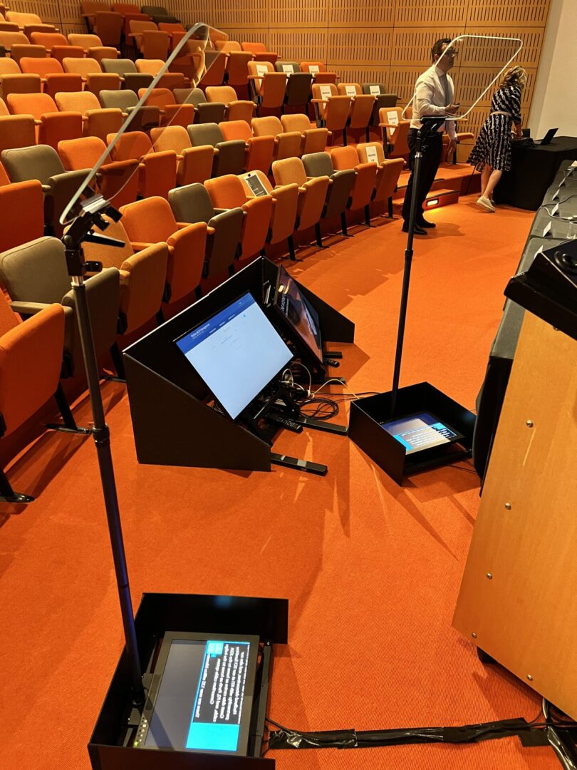 A podium with two speakers and one microphone.